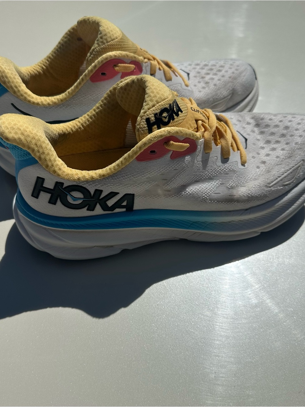 Hoka White Running Shoes with Yellow, Blue & Pink Accents - Picture 2 of 6
